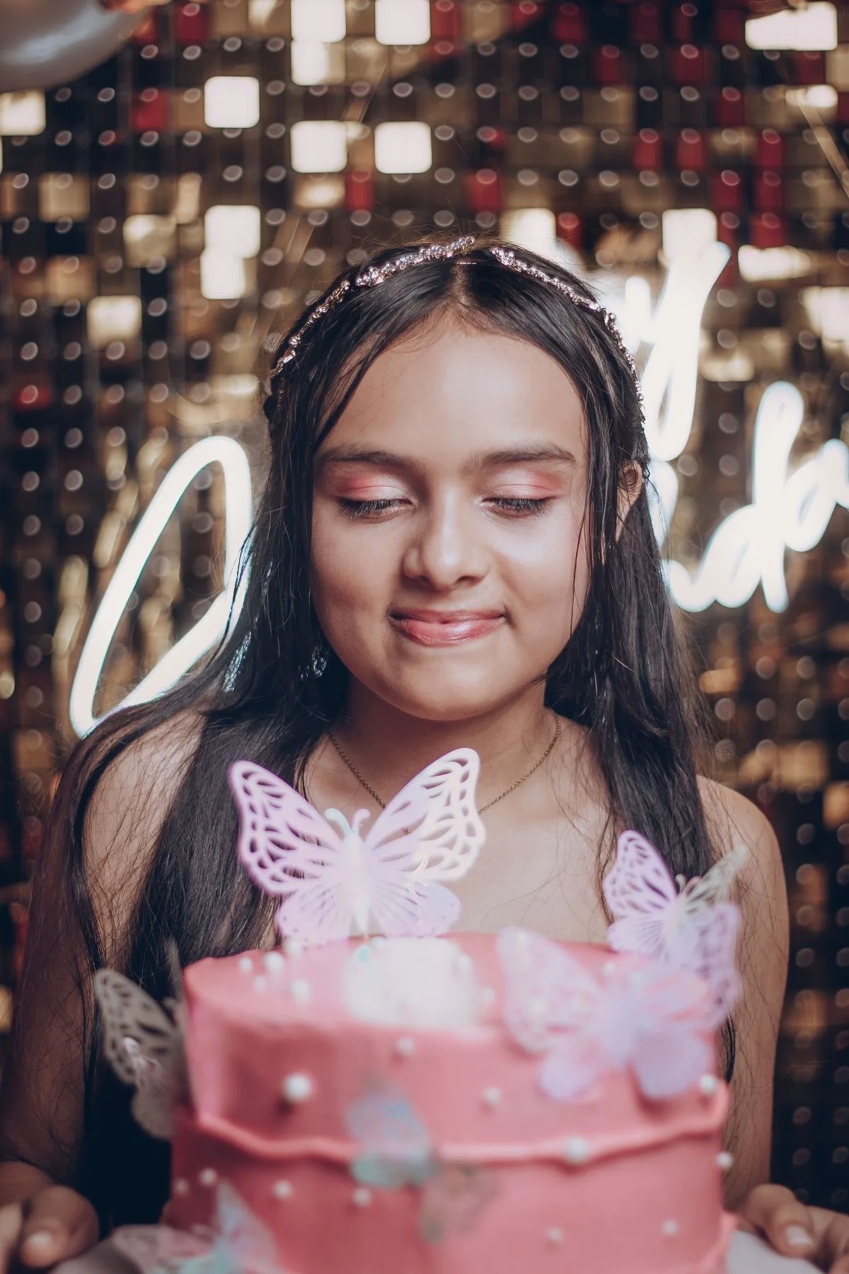 Indian teenager celebrating a birthday with a cake